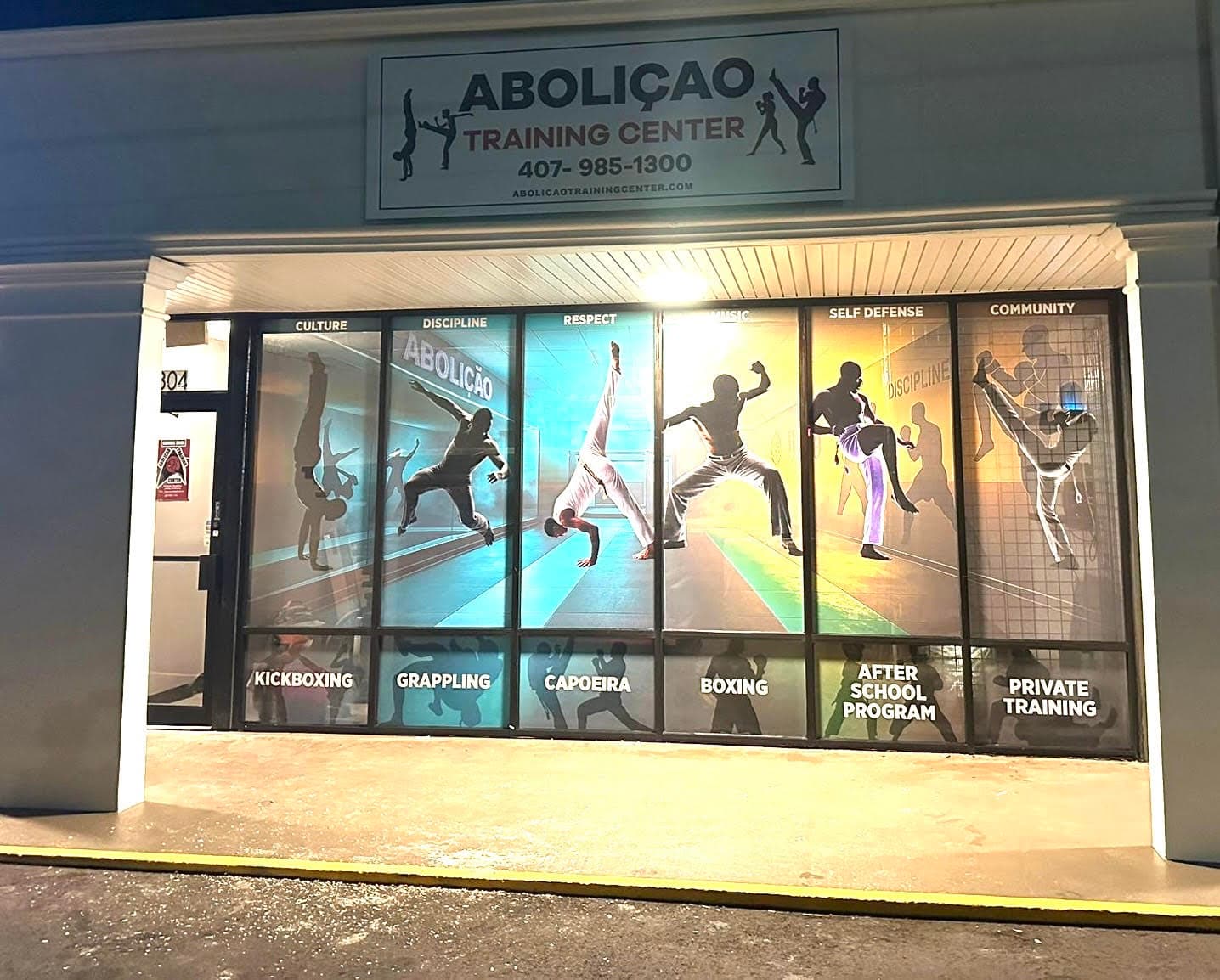 The Abolição Training Center storefront at night